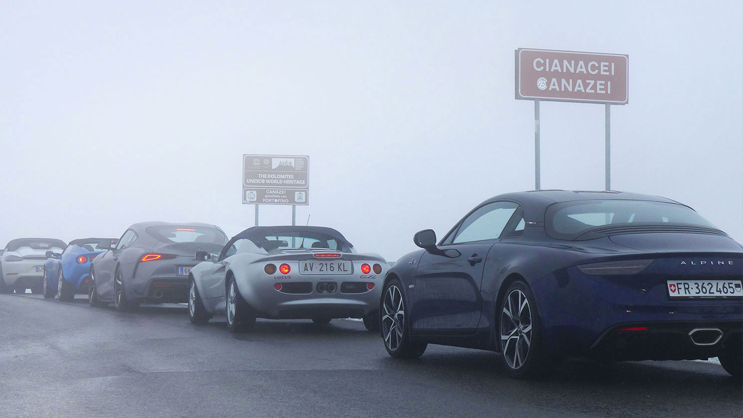 Cars at the top of the pass during the Dolomites Spring Tour